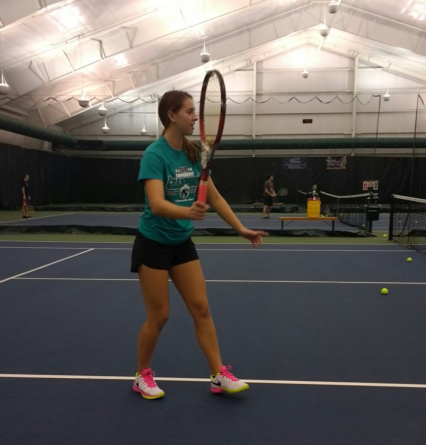 Former singles player Kiki Risgaard practices doubles strategy. 