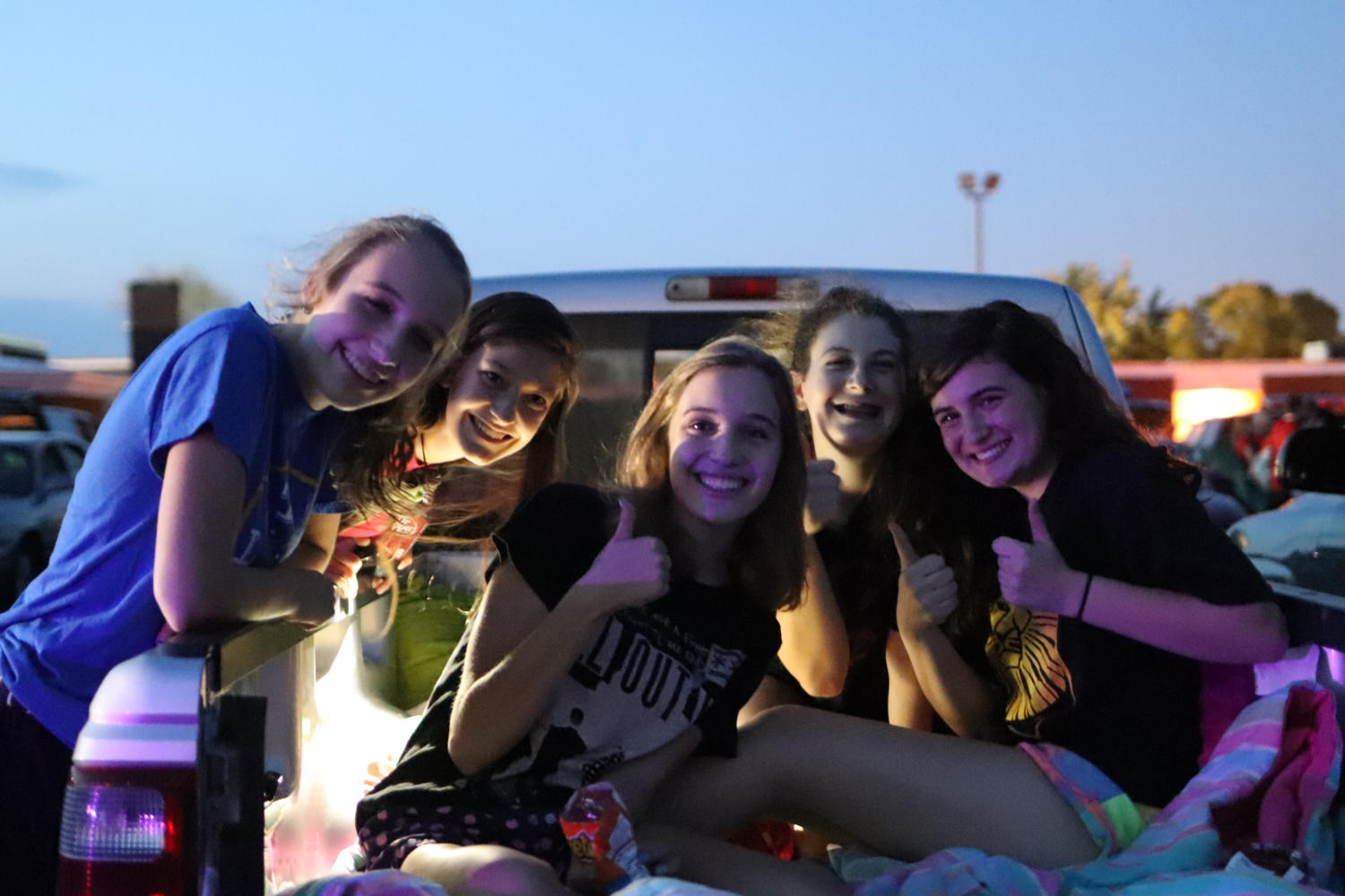 Students enjoy the warm weather and a bite to eat before the showing of Lion King.