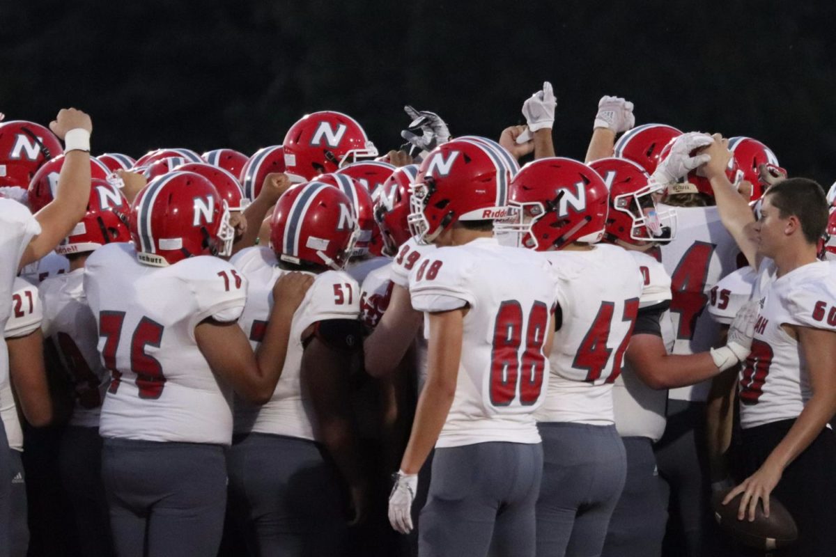 Our own Neenah Rockets huddle up before taking the field for the second half.