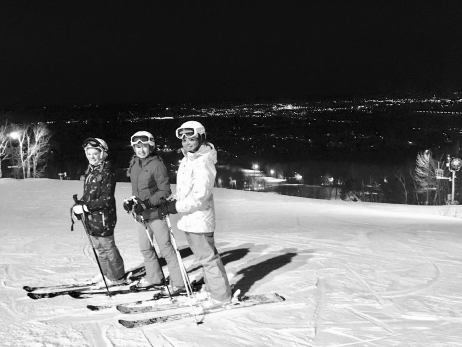 This photograph features senior Savannah Ely (right) on the slopes with family friends only moments before her accident.