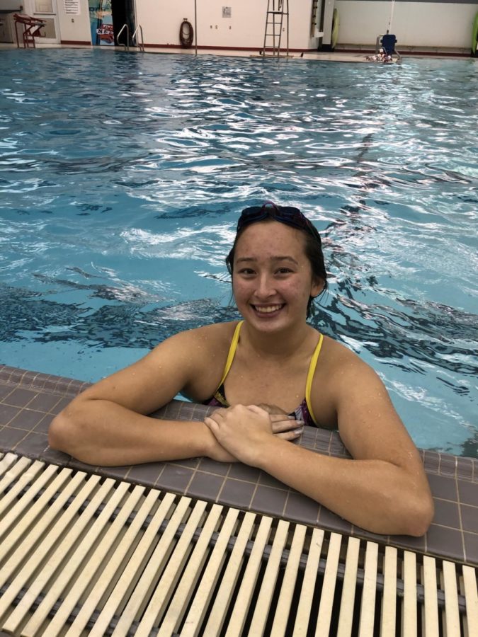 Senior Annika Strasman swims in the pool during senior wakeup.
