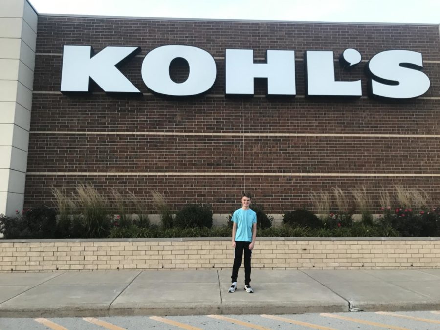 Landon Nytes, a cashier at Kohls, stands in front of Kohls department store.