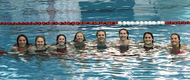 Members of the girls swim and dive prepare for state competition.