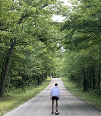 Cooper Moss enjoys the time away from his phone by longboarding.