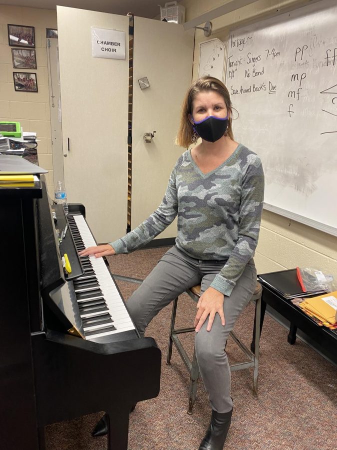 Miss Westcott at her piano in the choir room.