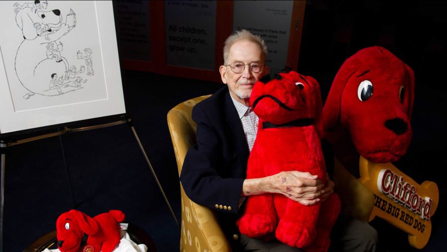 Author Norman Bridwell holds his stuffed famous character.