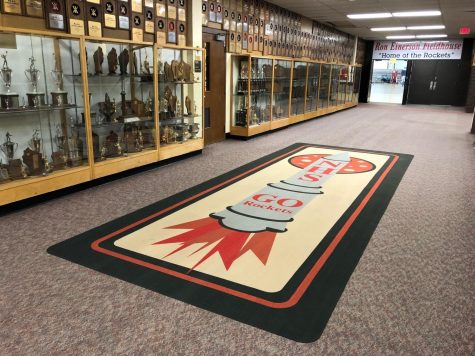 Our impressive trophy collection, and a carpet design created by students.