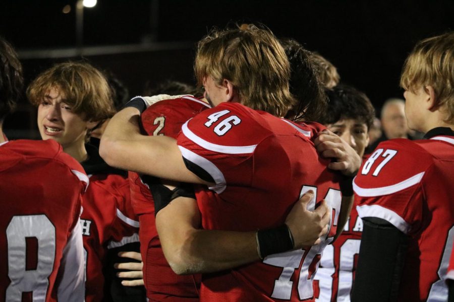 Players embrace post game after season ends with a loss to Kimberly.
