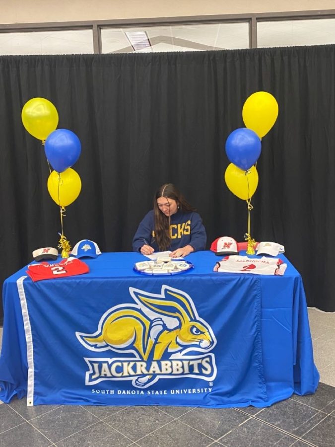 NHS+senior+Quinn+Marnocha+signs+her+National+Letter+of+Intent+to+play+collegiate+softball+at+South+Dakota+State+University.