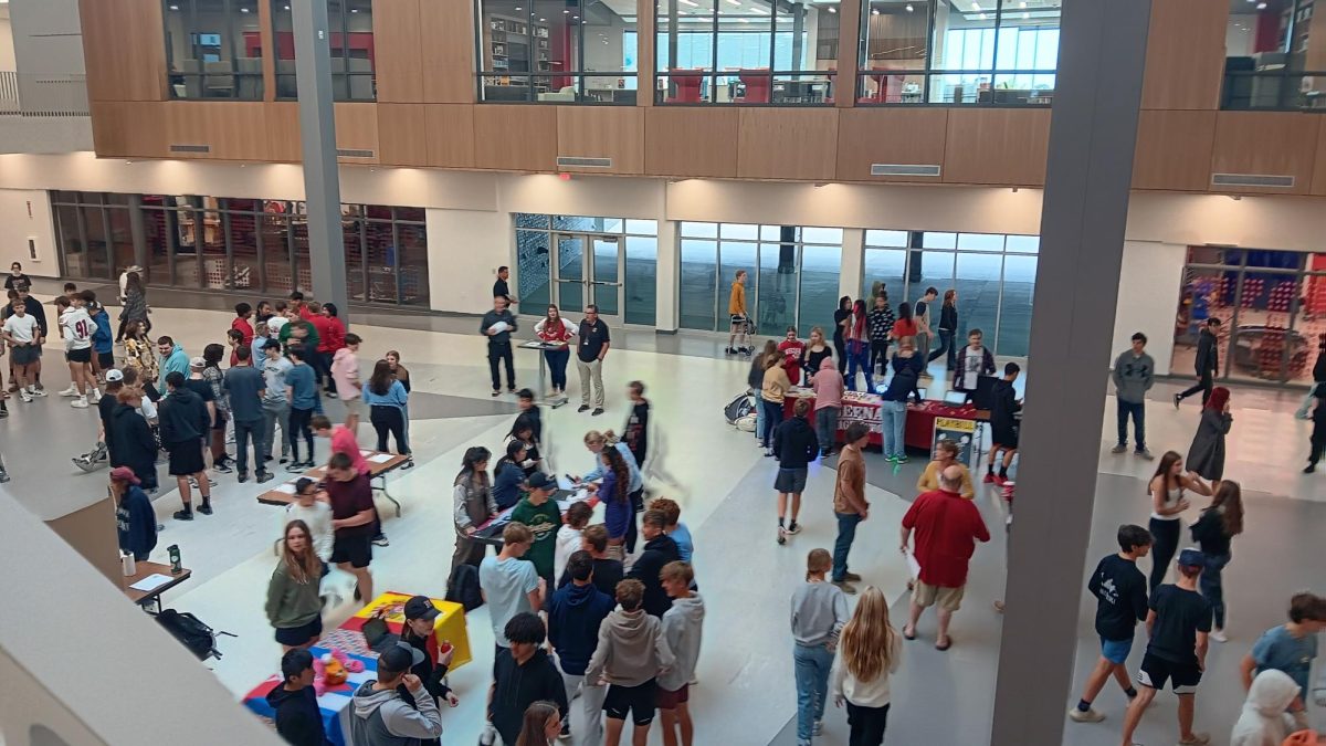 The student body attends Club Fair 2023 in the atrium.