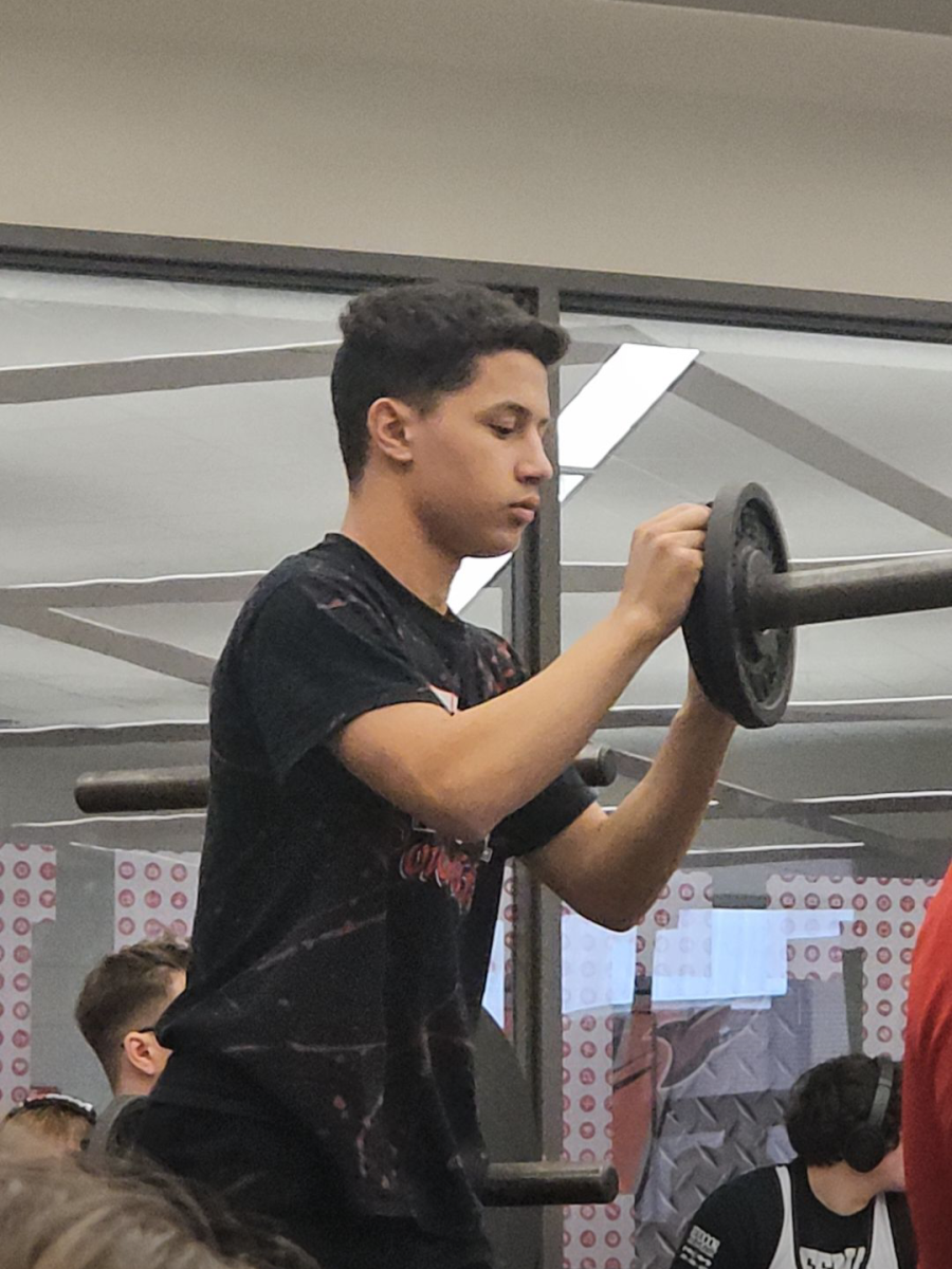 Athlete Josther Palermo loading a bar @ Intrasquad Meet